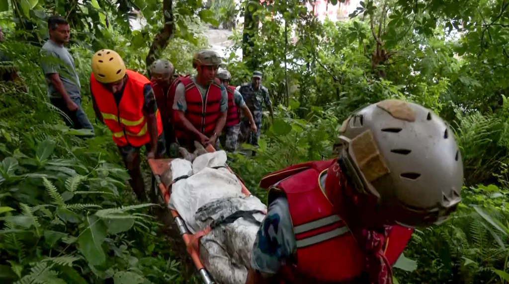 Security forces and disaster management teams retrieve bodies from the flash-flood-affected Battar Bazar area, in Nuwakot on Thursday / ANI 