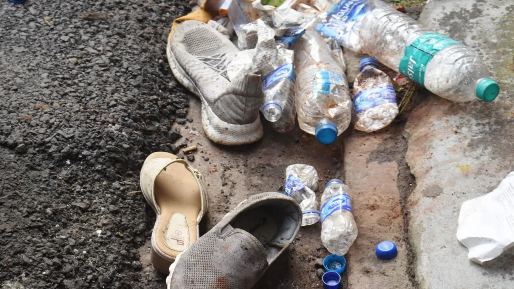 People's belongings left at the Chorbagan Durga Puja pandal site following the stampede incident (Oct 17), in Kolkata on Sunday. 