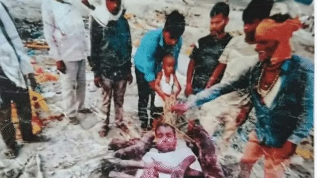 A dead goat was put on the pyre, and the man's face was superimposed on it.