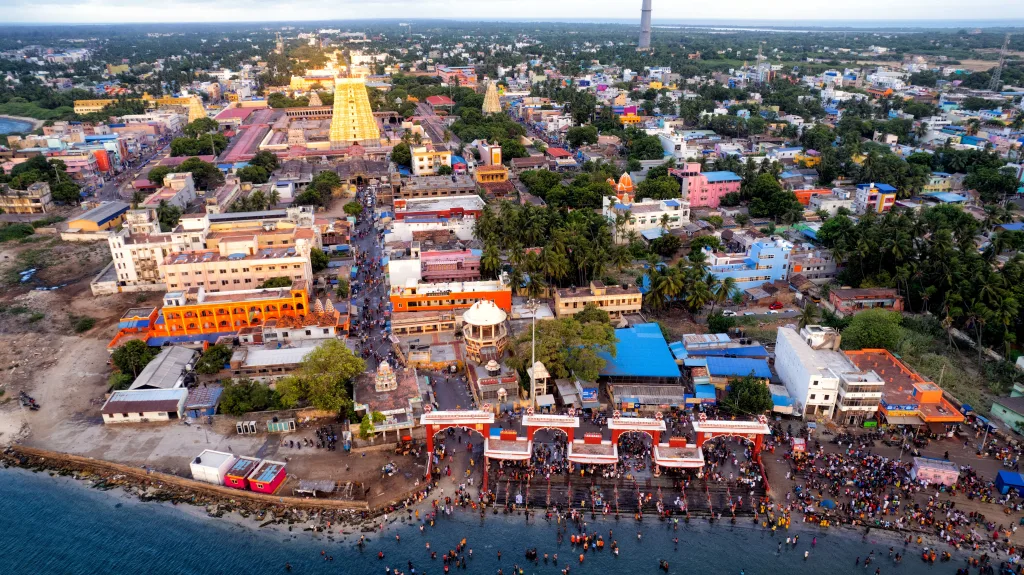 A vibrant aerial view of Rameswaram city and temple, Tamil Nadu, India, showcasing bustling streets and coastline.