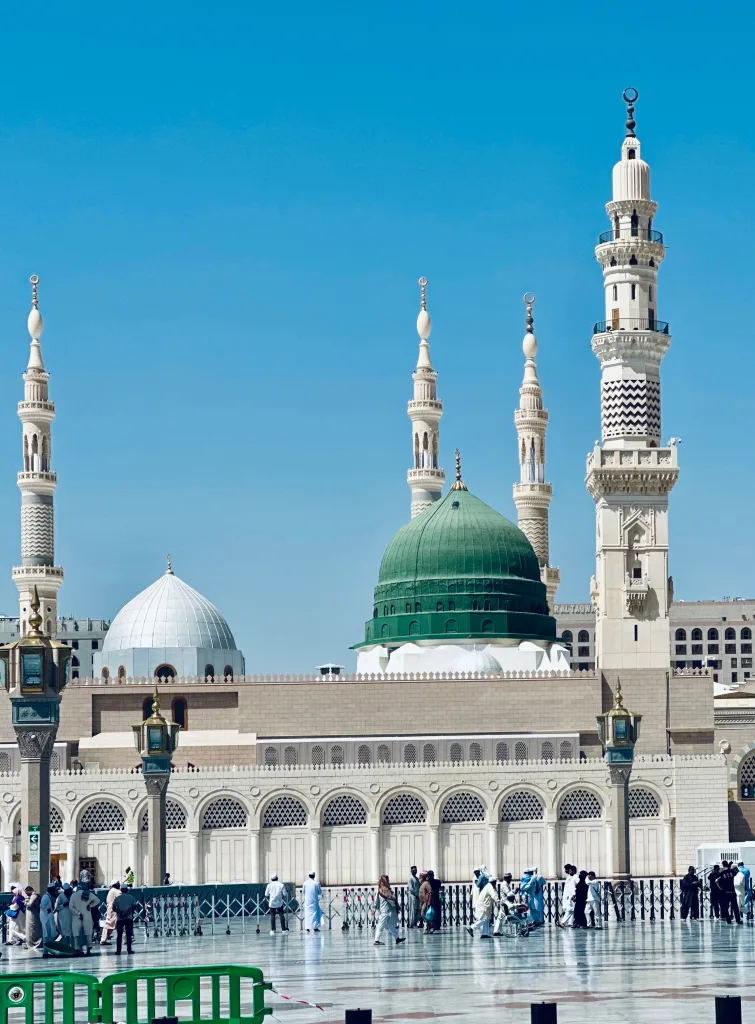 A beautiful view of Al-Masjid an-Nabawi with its iconic green dome in Madinah, Saudi Arabia