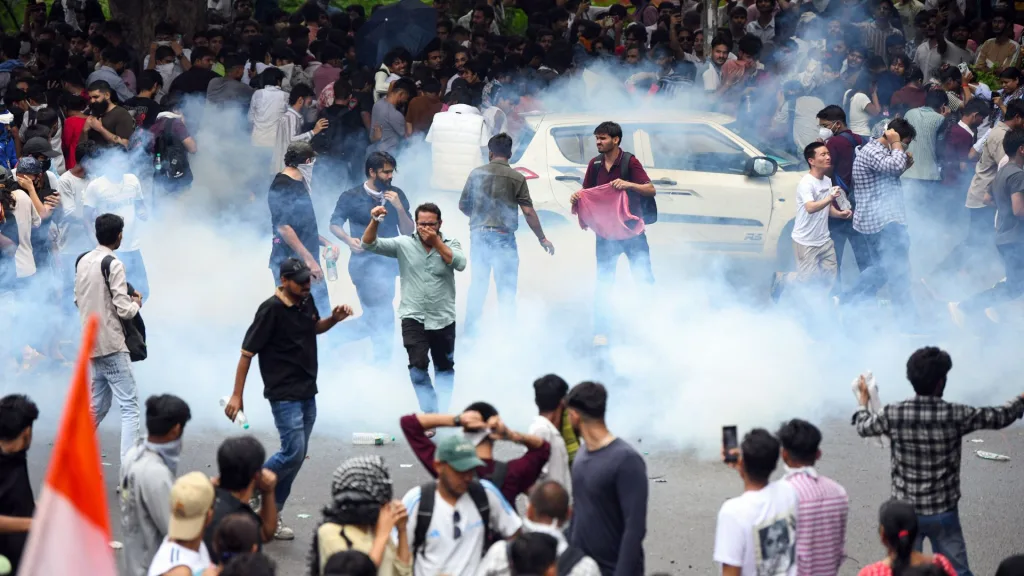 Security personnel fire tear gas shells at protesters near Jantar Mantar