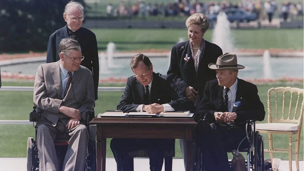 President Bush signs the Americans with Disabilities Act into law