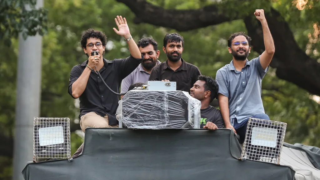CJP supporters and students celebrate after Dharmendra Pradhan resigns from his post